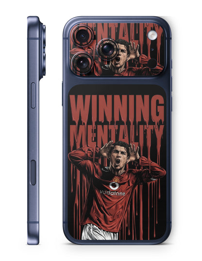 A dark blue protective phone case shown from both the side and back views. The back of the case features a graphic print of a soccer player in a red Manchester United jersey celebrating, with the words 'WINNING MENTALITY' in a dripping red font on a black background.
